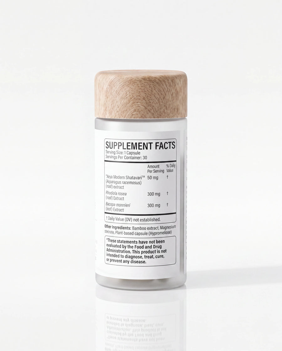 A clear supplement bottle with a light natural wood lid and a white label reading 'SUPPLEMENT FACTS', photographed on a clean white background with a soft reflection below.